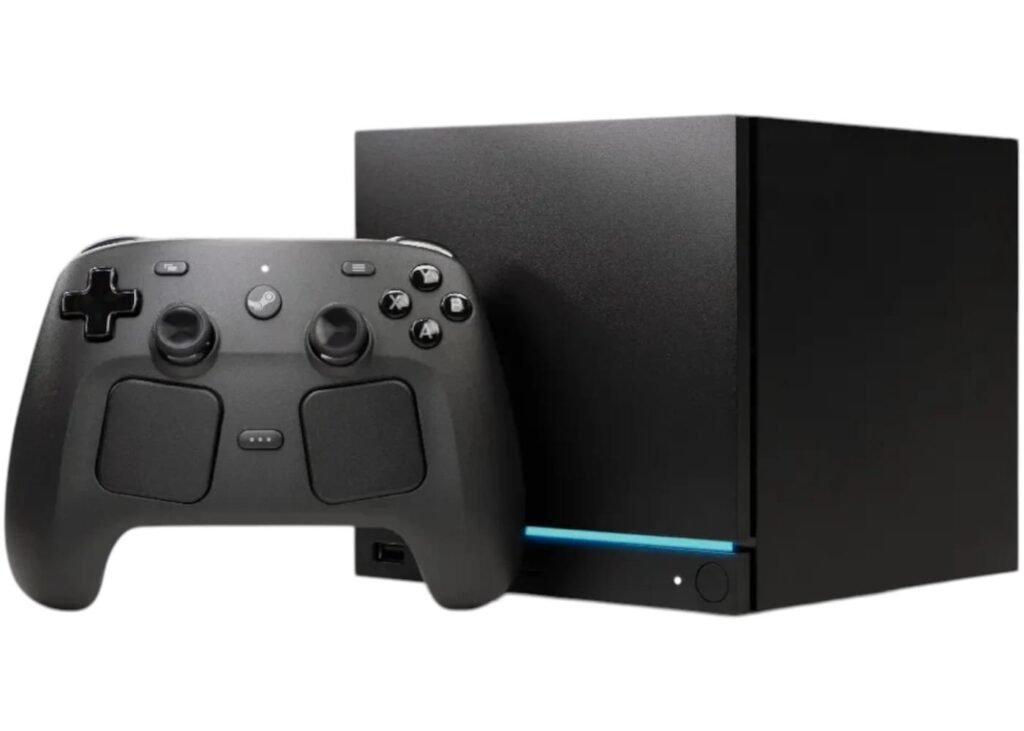 Black Steam Machine console with a matching wireless controller featuring dual trackpads and standard action buttons on a plain white background.