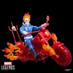Marvel Legends Ghost Rider action figure riding a red motorcycle with translucent orange flame effects.