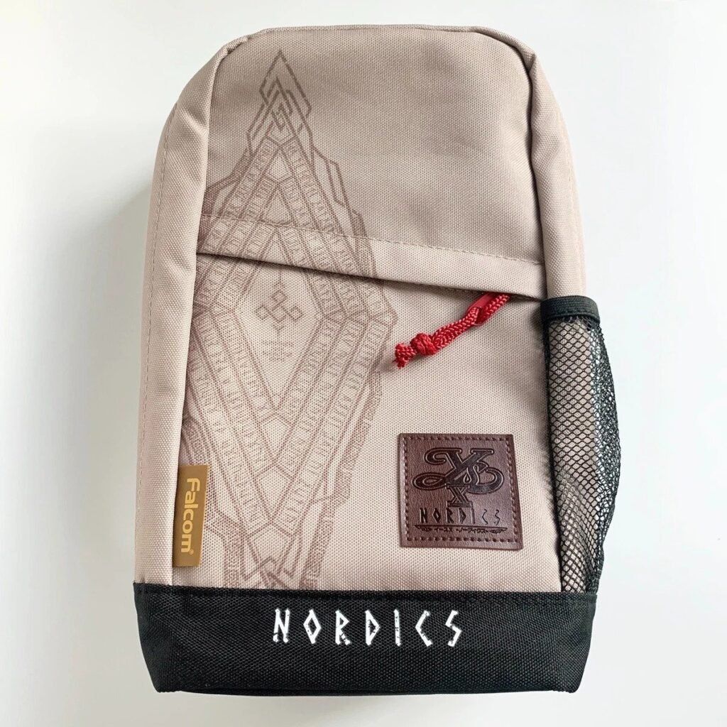 Falcom Ys X Nordics beige canvas pouch featuring a printed geometric design, side mesh pocket, and red zipper pull.
