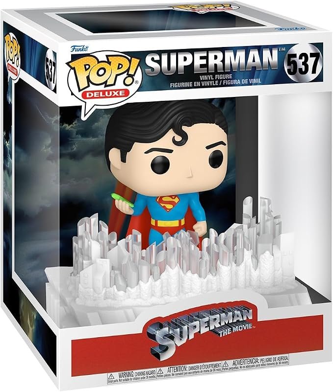 Funko Pop Deluxe Superman The Movie 537 vinyl figure in box displaying Superman standing on a crystalline Fortress of Solitude base.
